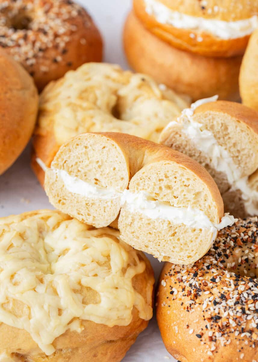 Stack of bagels with cream cheese. 