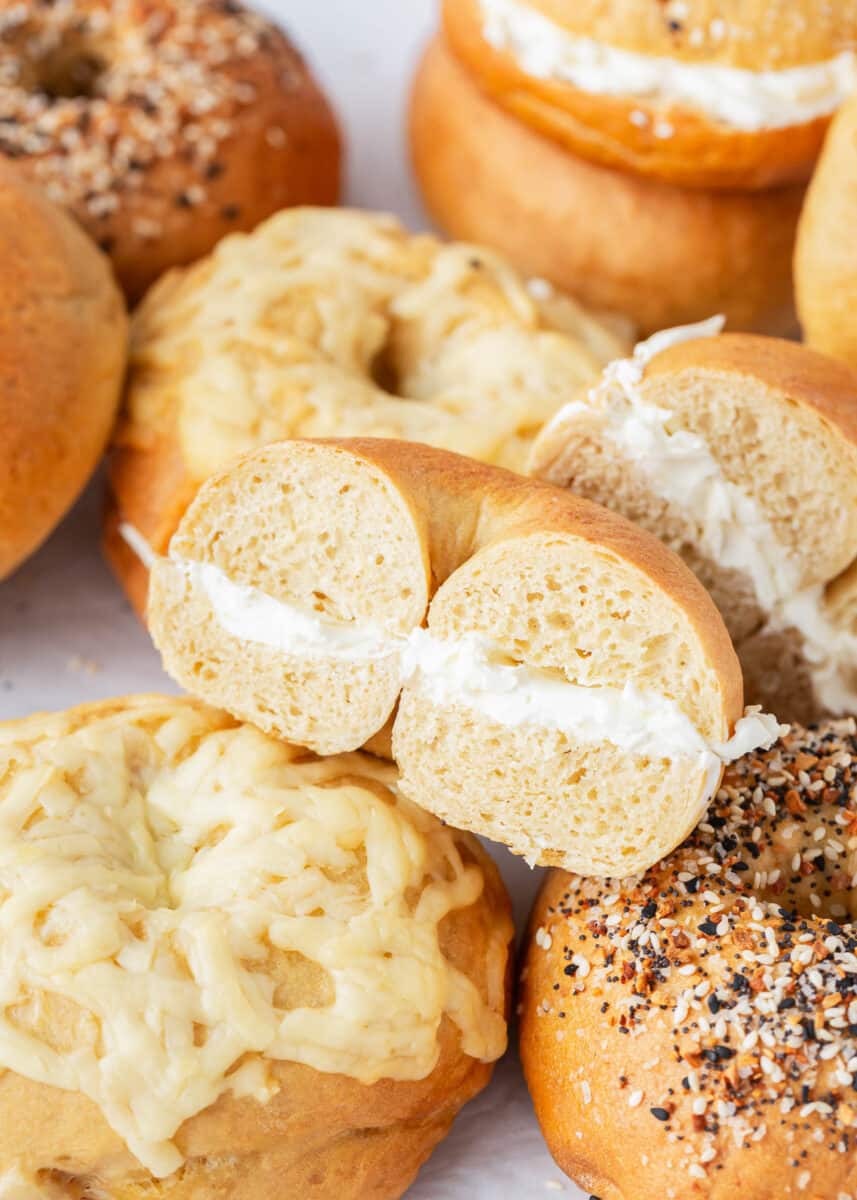 Stack of bagels with cream cheese.