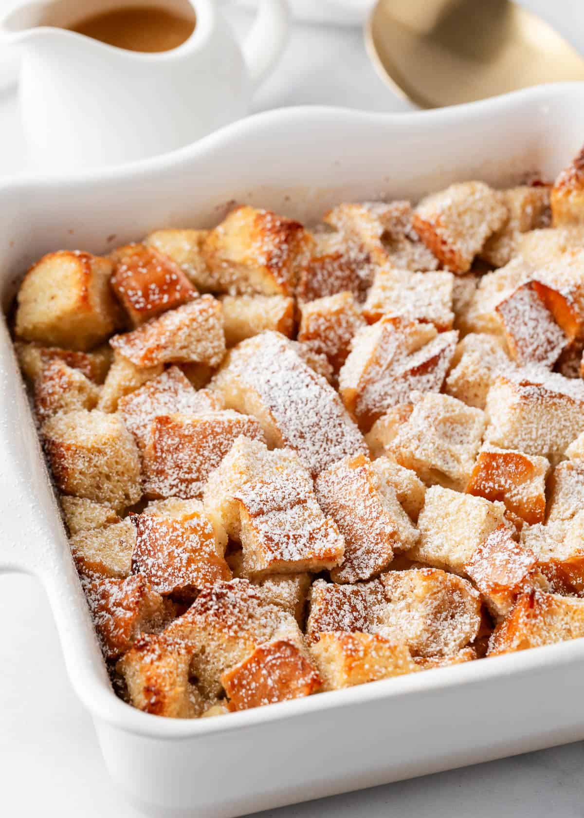 Bread pudding in a white dish.