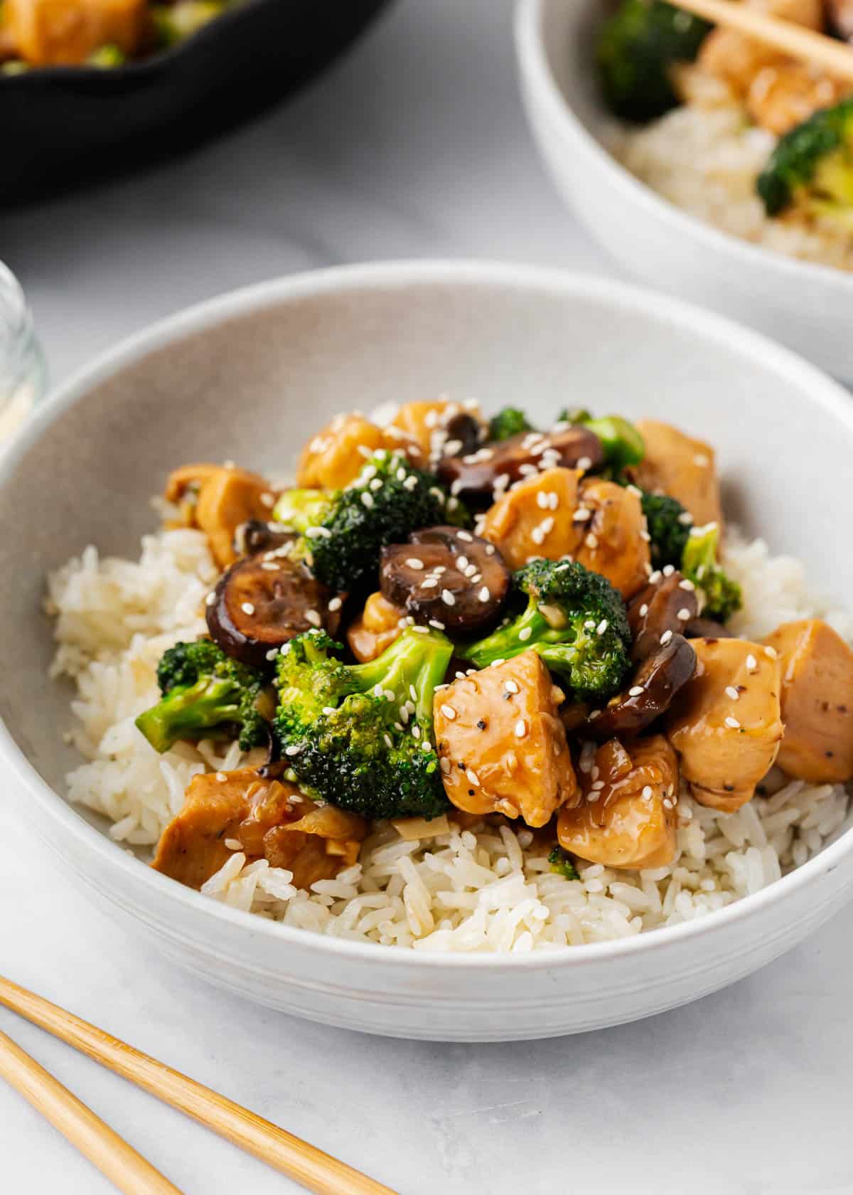 Chicken and broccoli stir fry in a bowl.