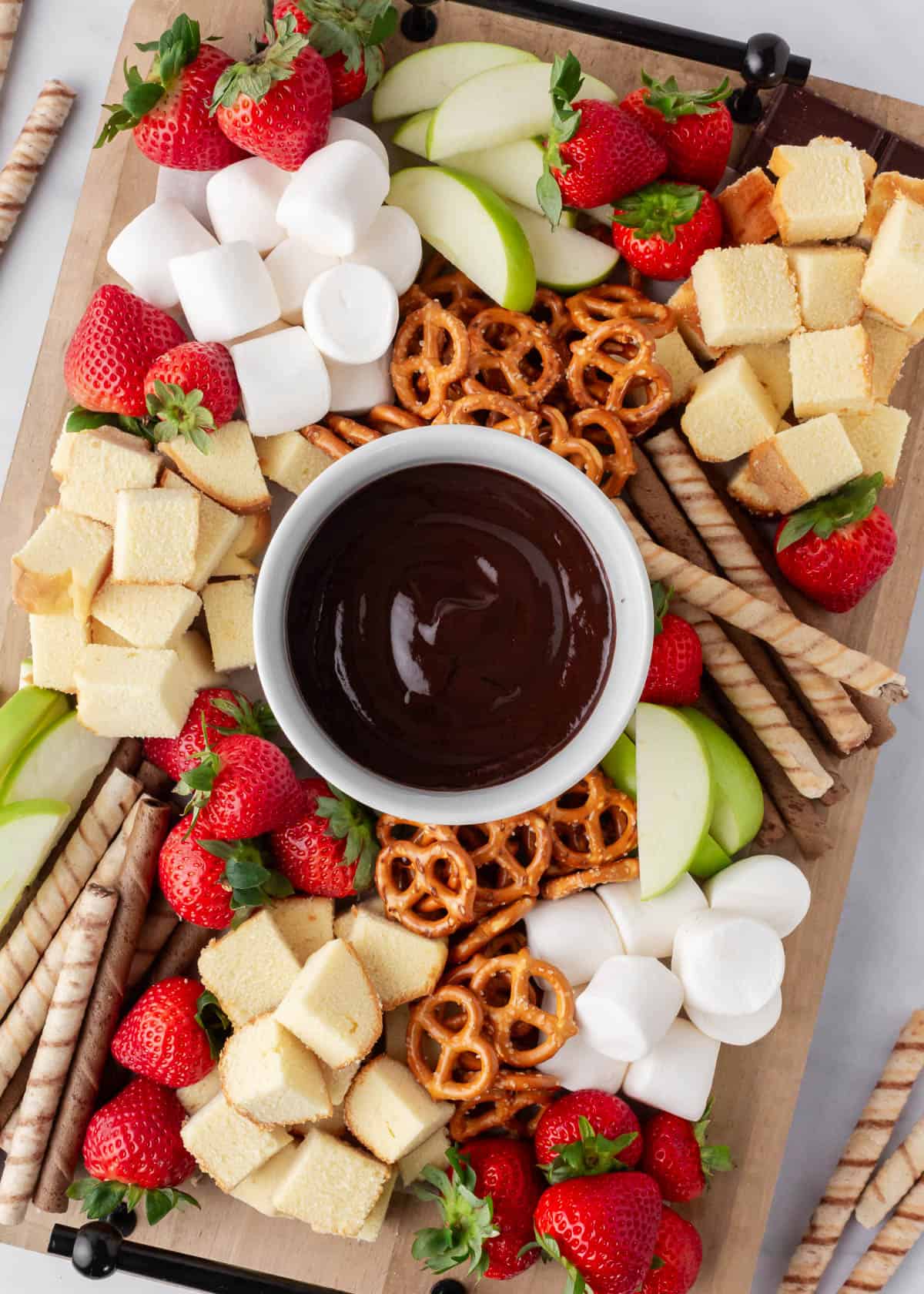 Chocolate fondue board on the counter.