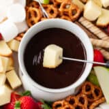 Dipping cake into chocolate fondue.