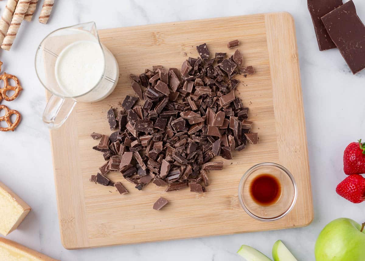 Chocolate fondue ingredients on the counter.