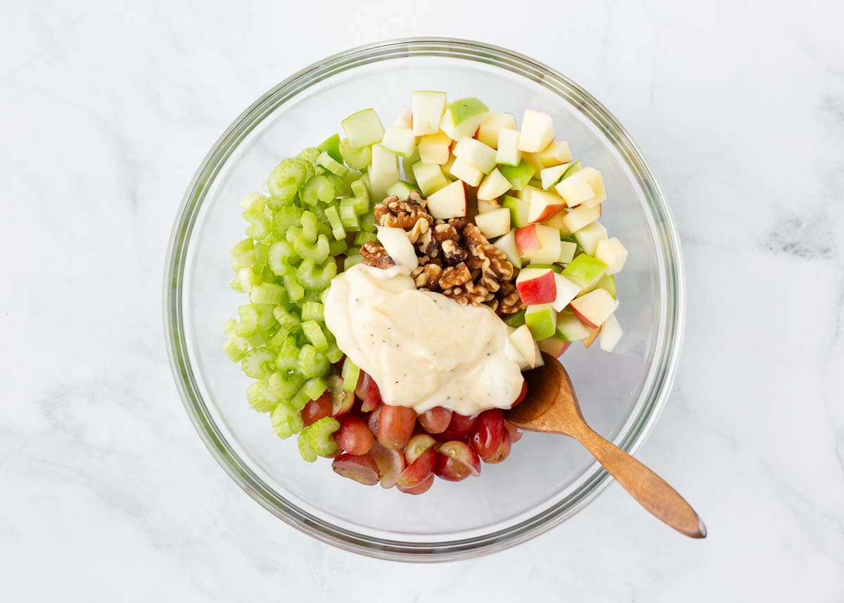 Showing how to make Waldorf salad in a bowl. 