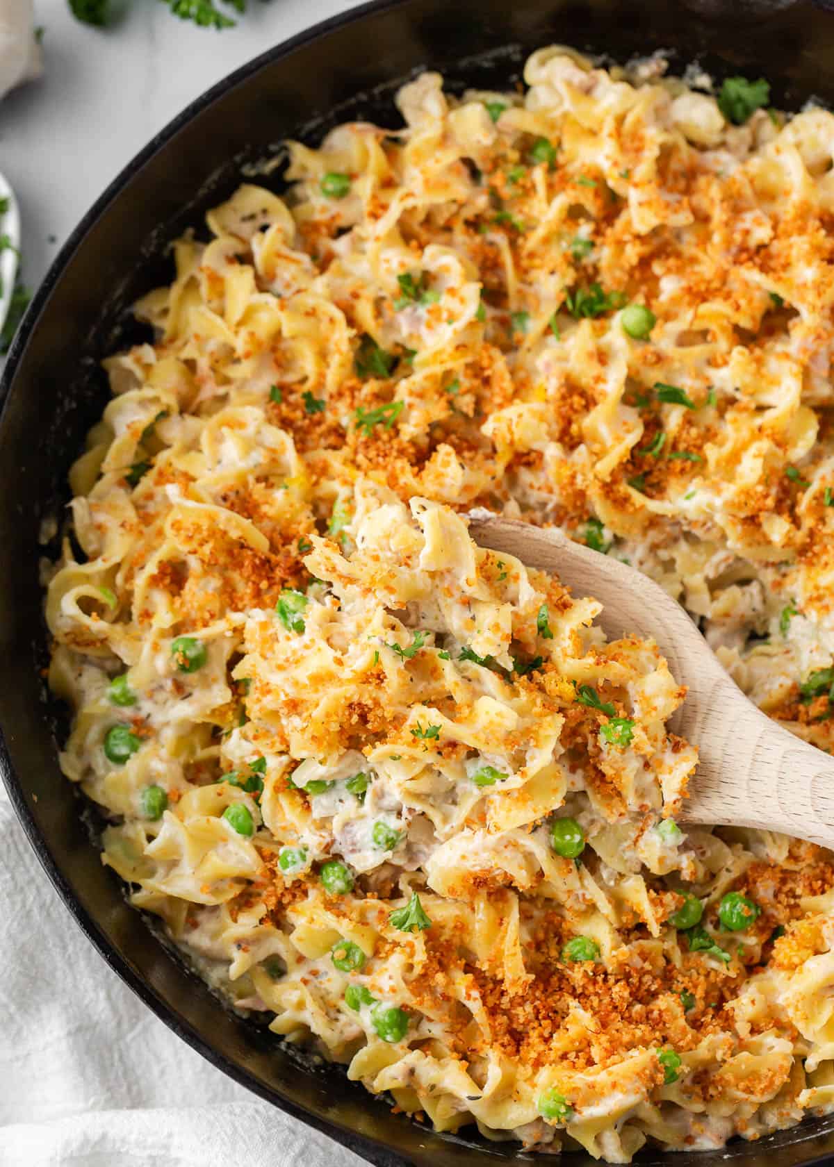 Tuna noodle casserole cooked in a skillet. 