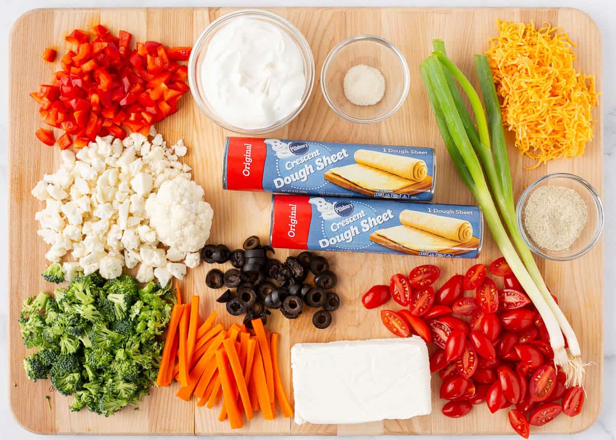 Veggie pizza ingredients on the counter.