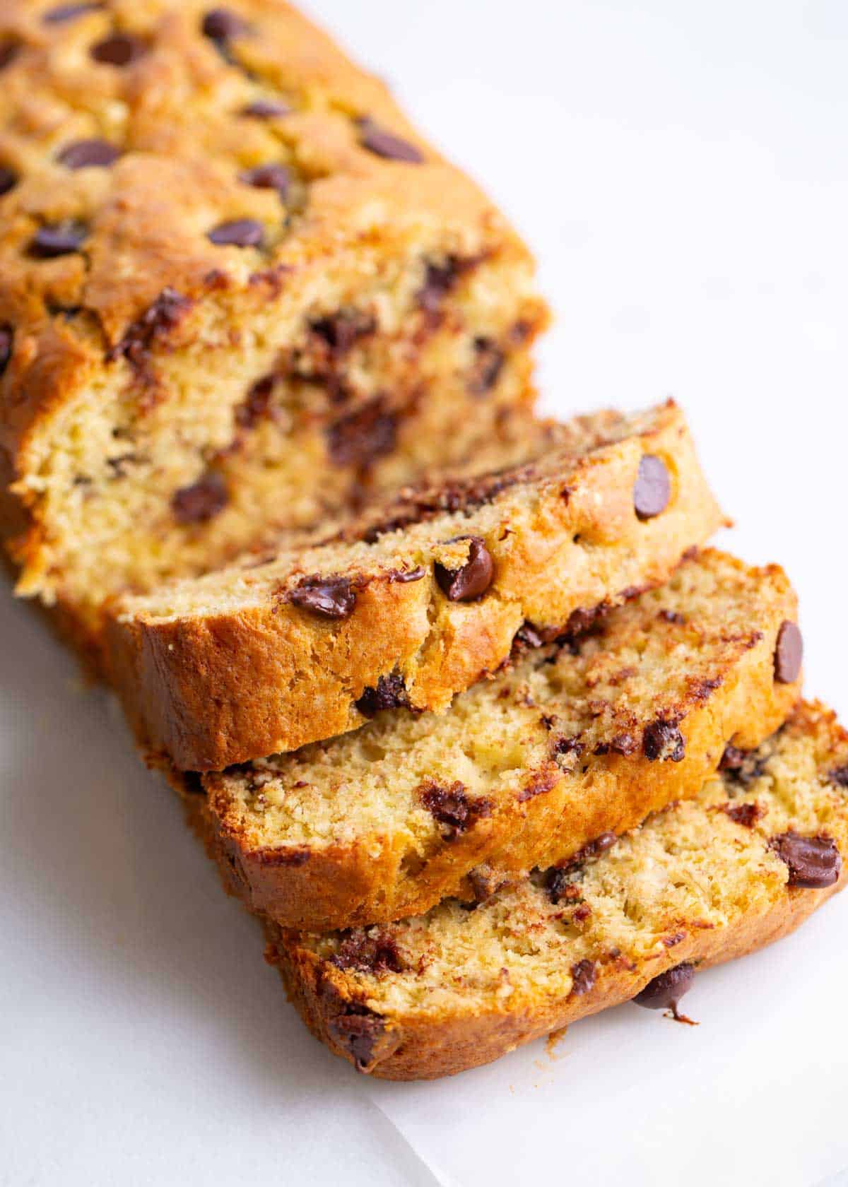 Sliced banana bread with cake mix on the counter.