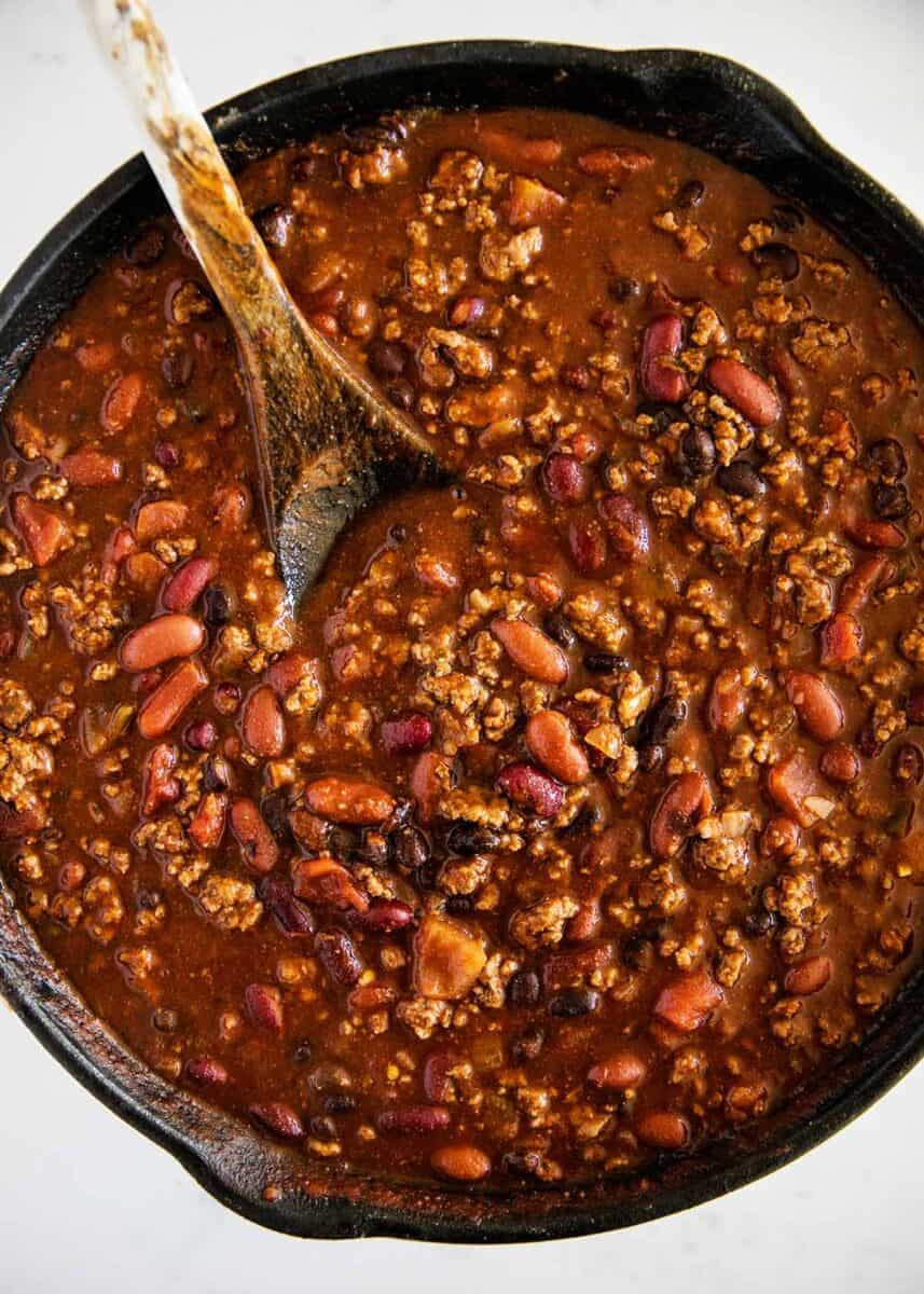 Cooking homemade chili in a skillet.