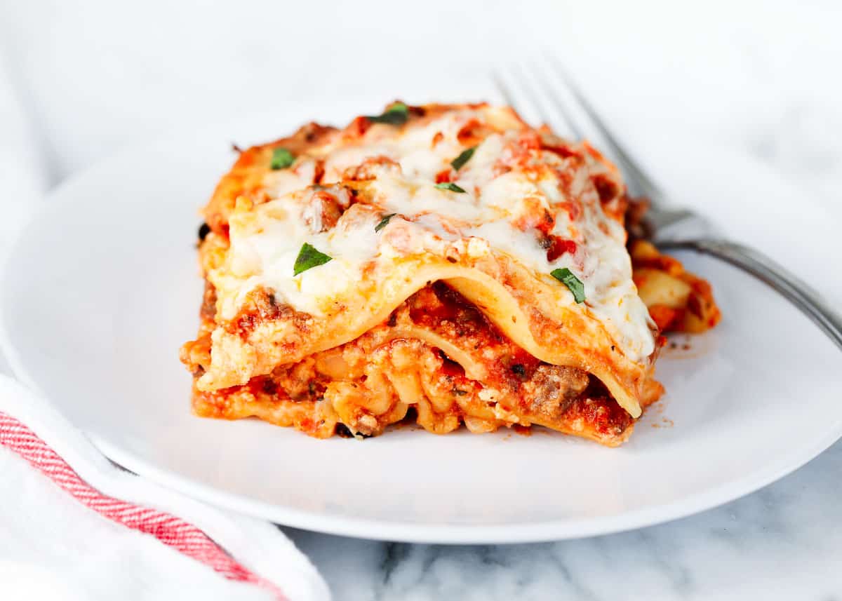 Crockpot lasagna on a white plate.