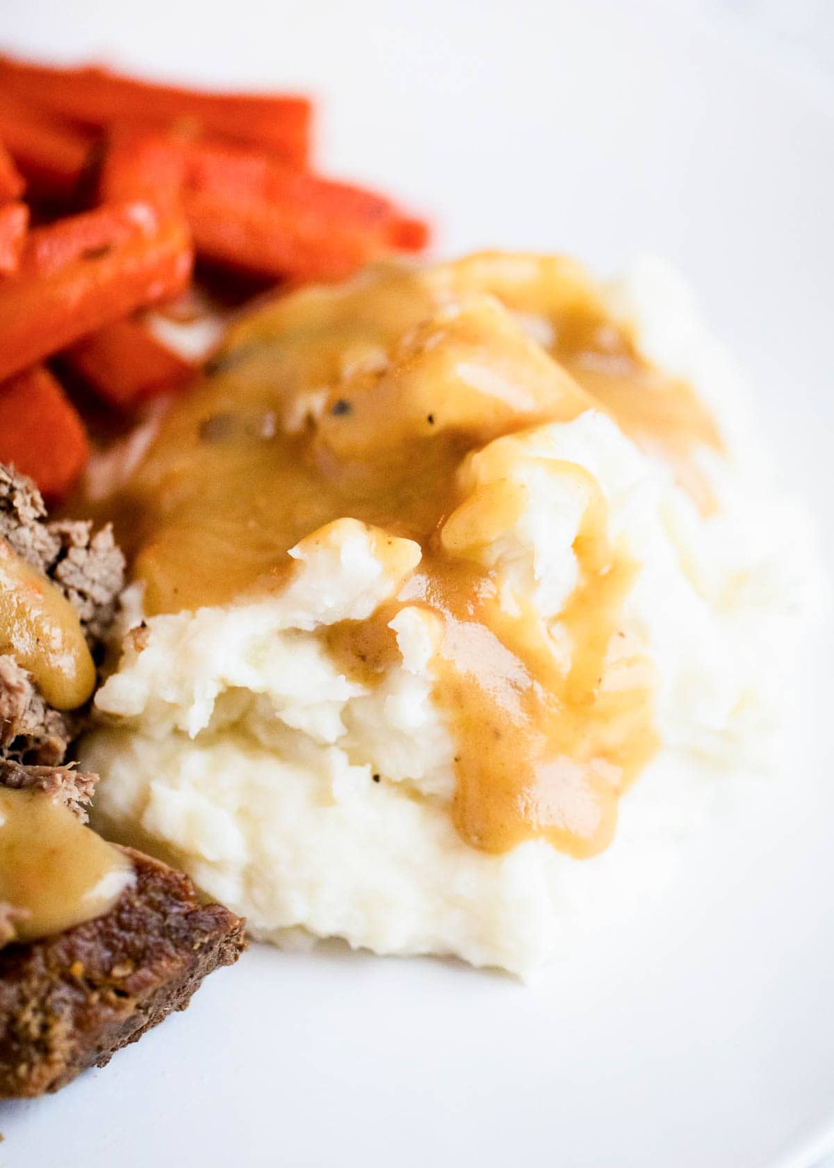 Homemade gravy and mashed potatoes.