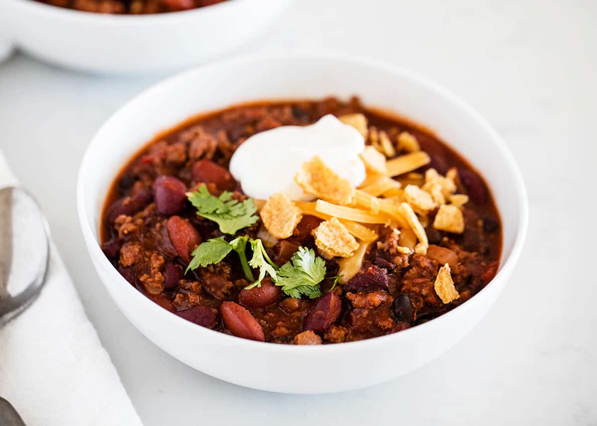 Best homemade chili in a bowl with toppings.