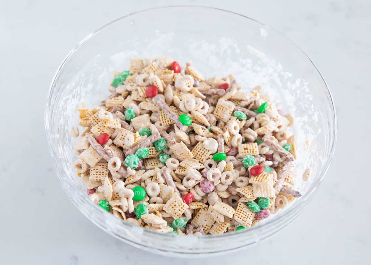Christmas Chex Mix combined in a bowl.