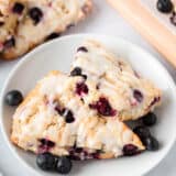 Blueberry scones on a white plate.