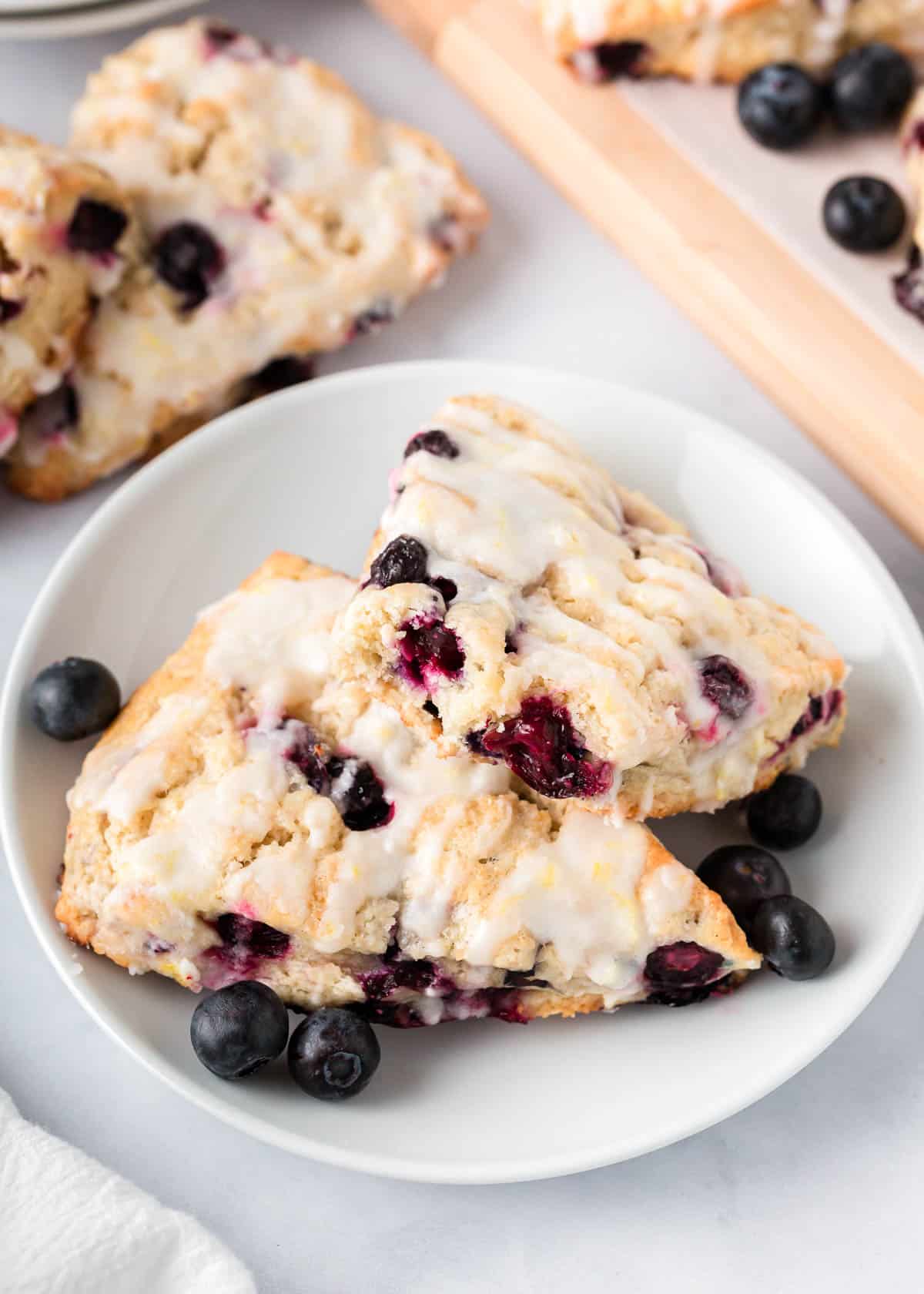 Blueberry scones on a white plate.