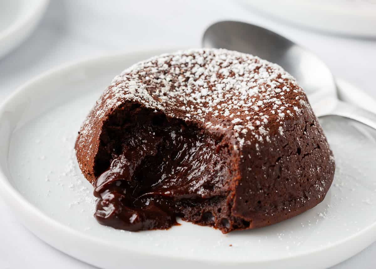 Chocolate lava cake on a white plate.