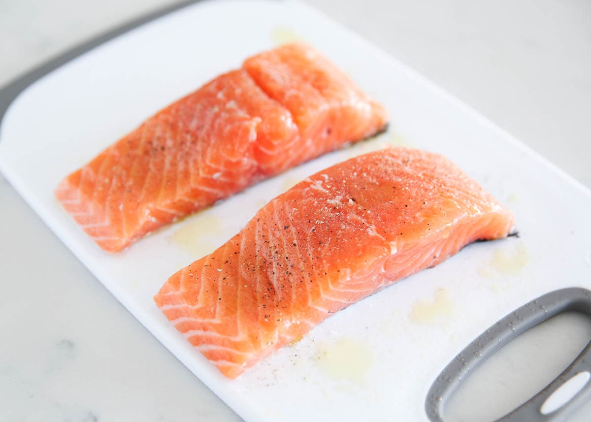 Salmon on a cutting board.