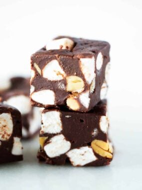 The best rocky road fudge stacked on a plate.