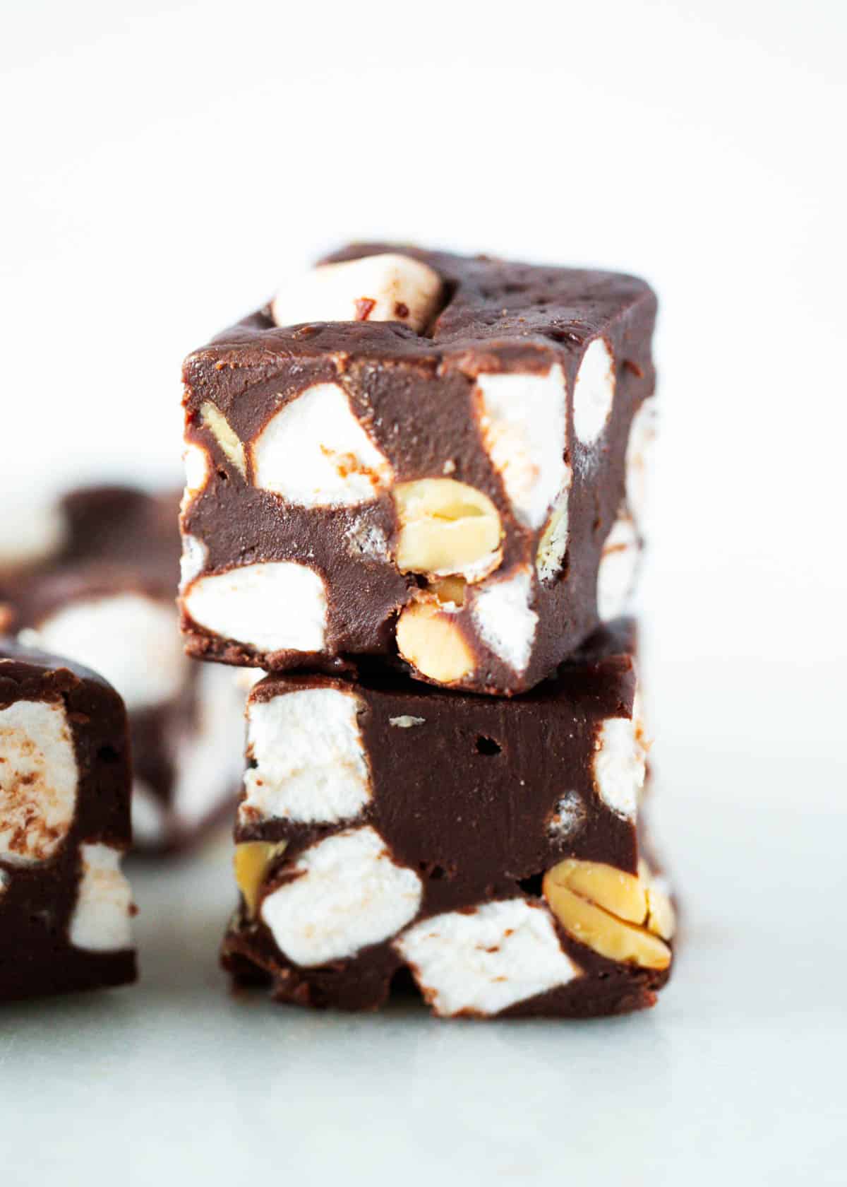 The best rocky road fudge stacked on a plate. 