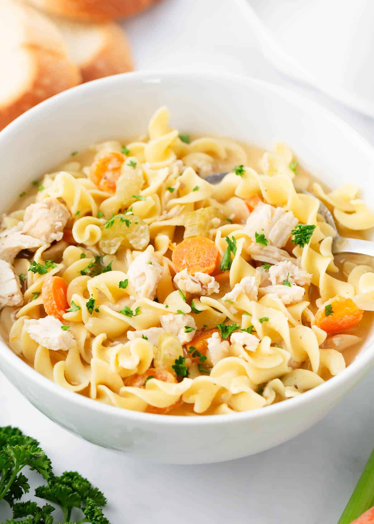 Crockpot chicken noodle soup in a bowl.