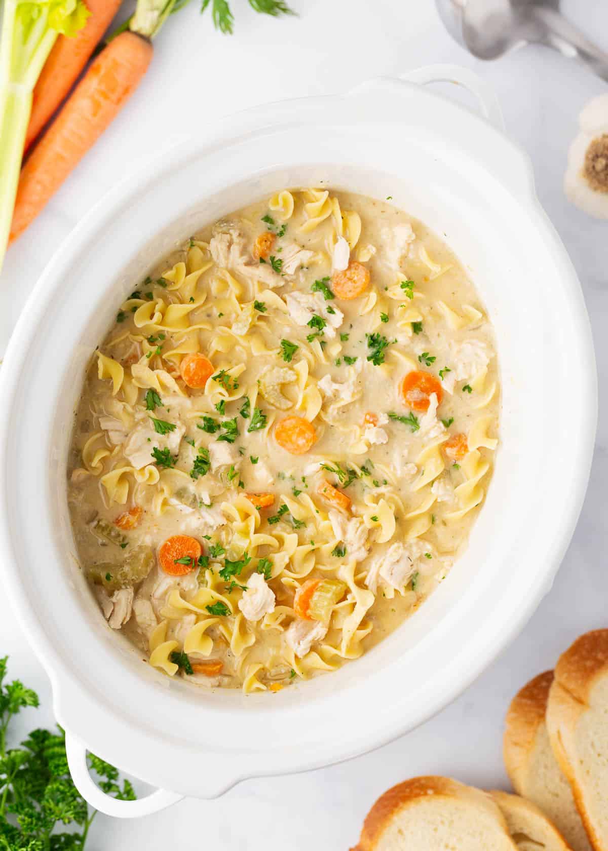 Crockpot chicken noodle soup in a crockpot.