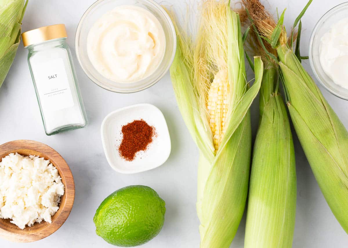 Elote dip ingredients on the counter.