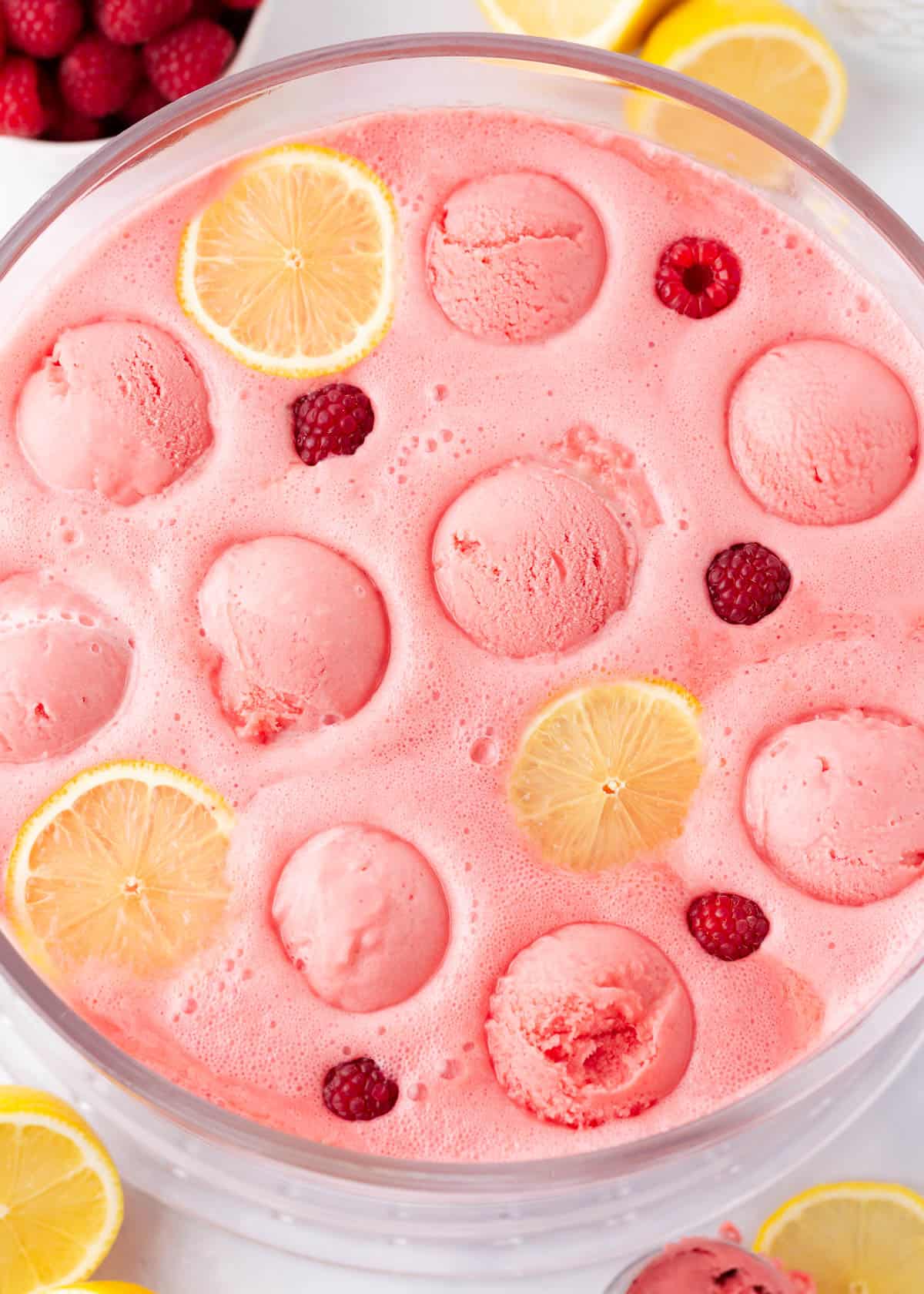 Pink sherbet punch in a punch bowl.