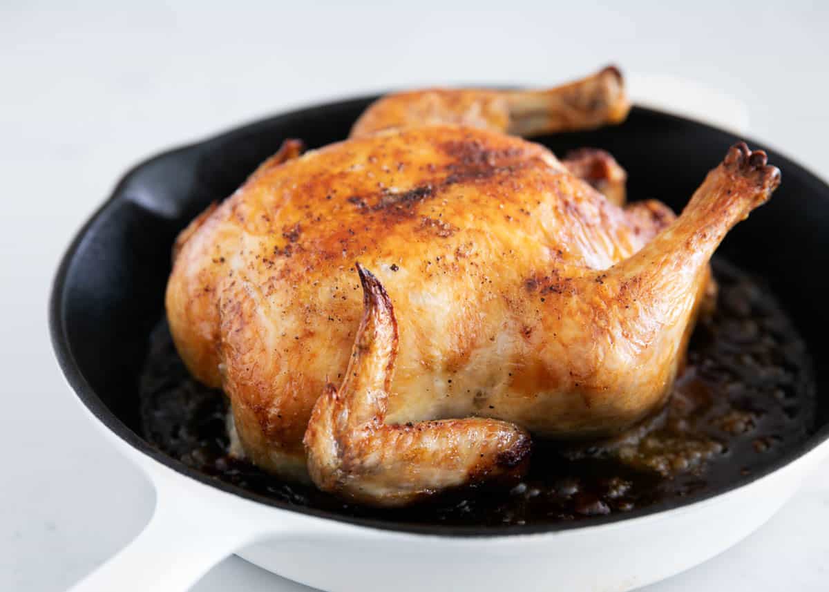 Roasted chicken in an iron skillet. 
