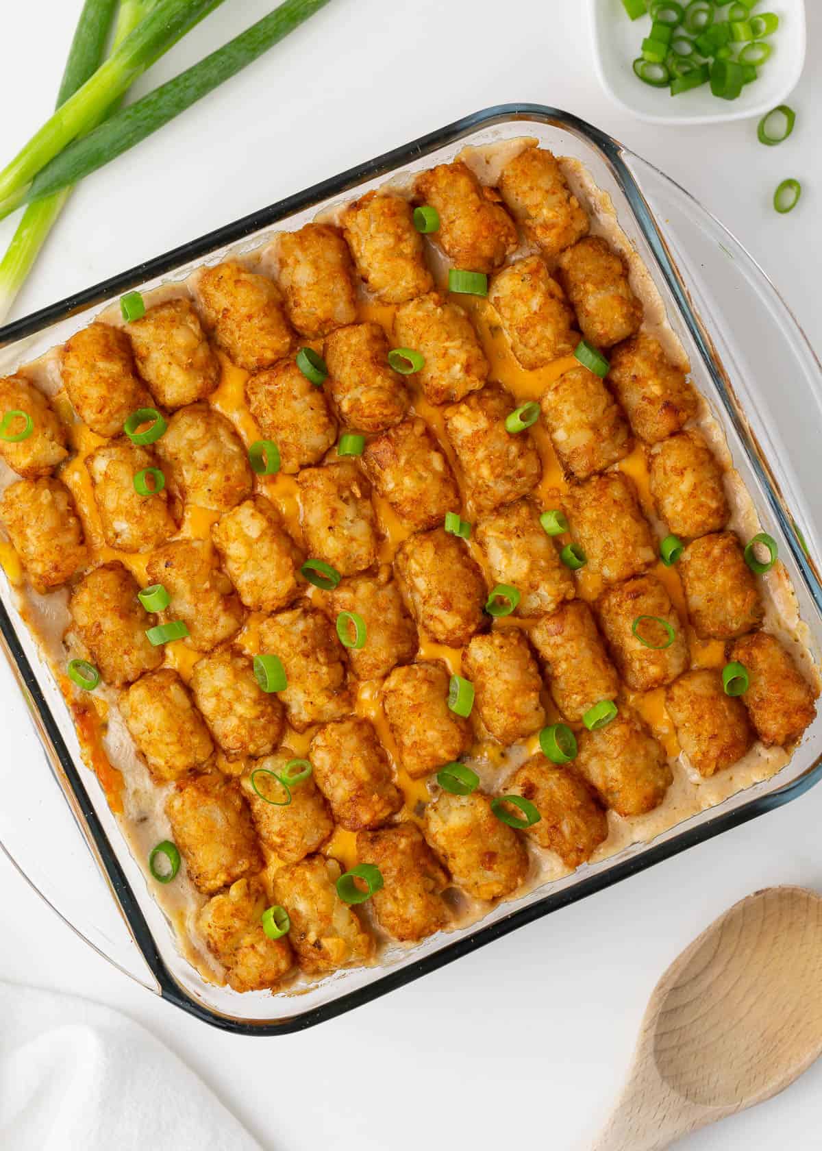 Tater tot casserole in a glass baking dish.