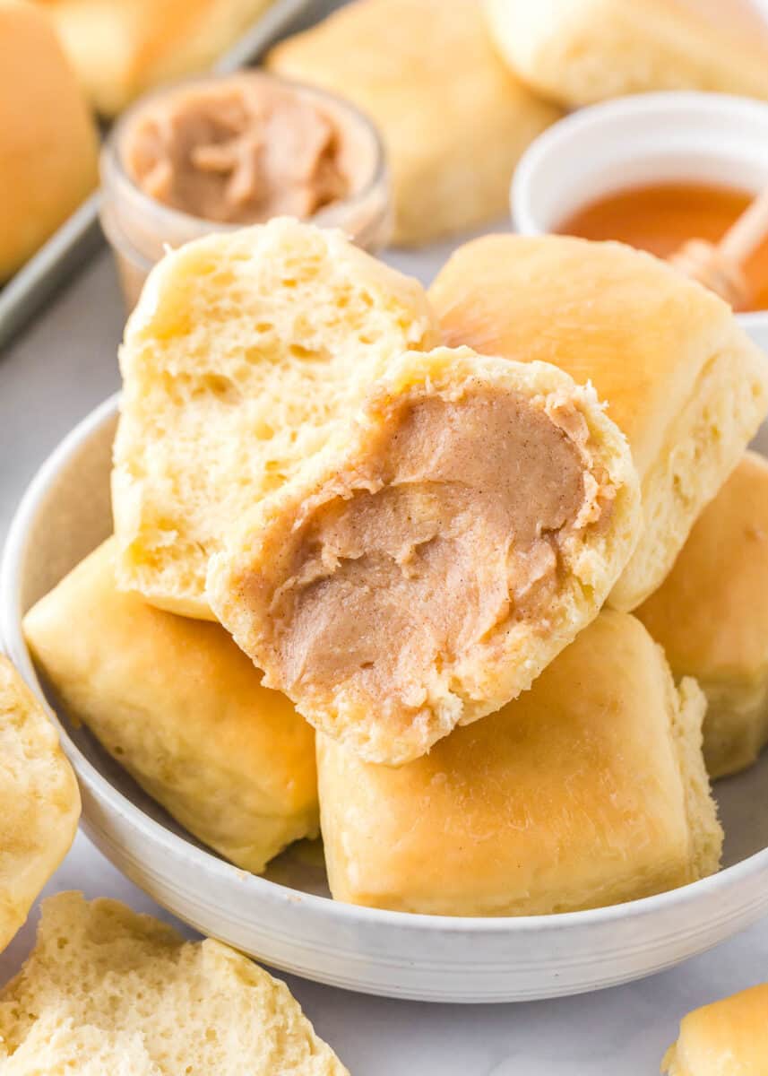 Texas Roadhouse Rolls on a plate with cinnamon butter.
