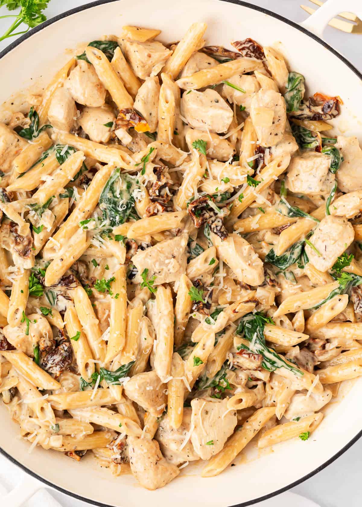 Tuscan chicken pasta in a dish. 