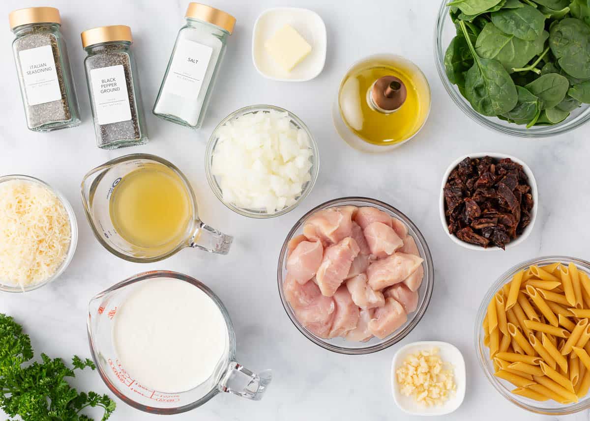 Tuscan chicken pasta ingredients on the counter. 