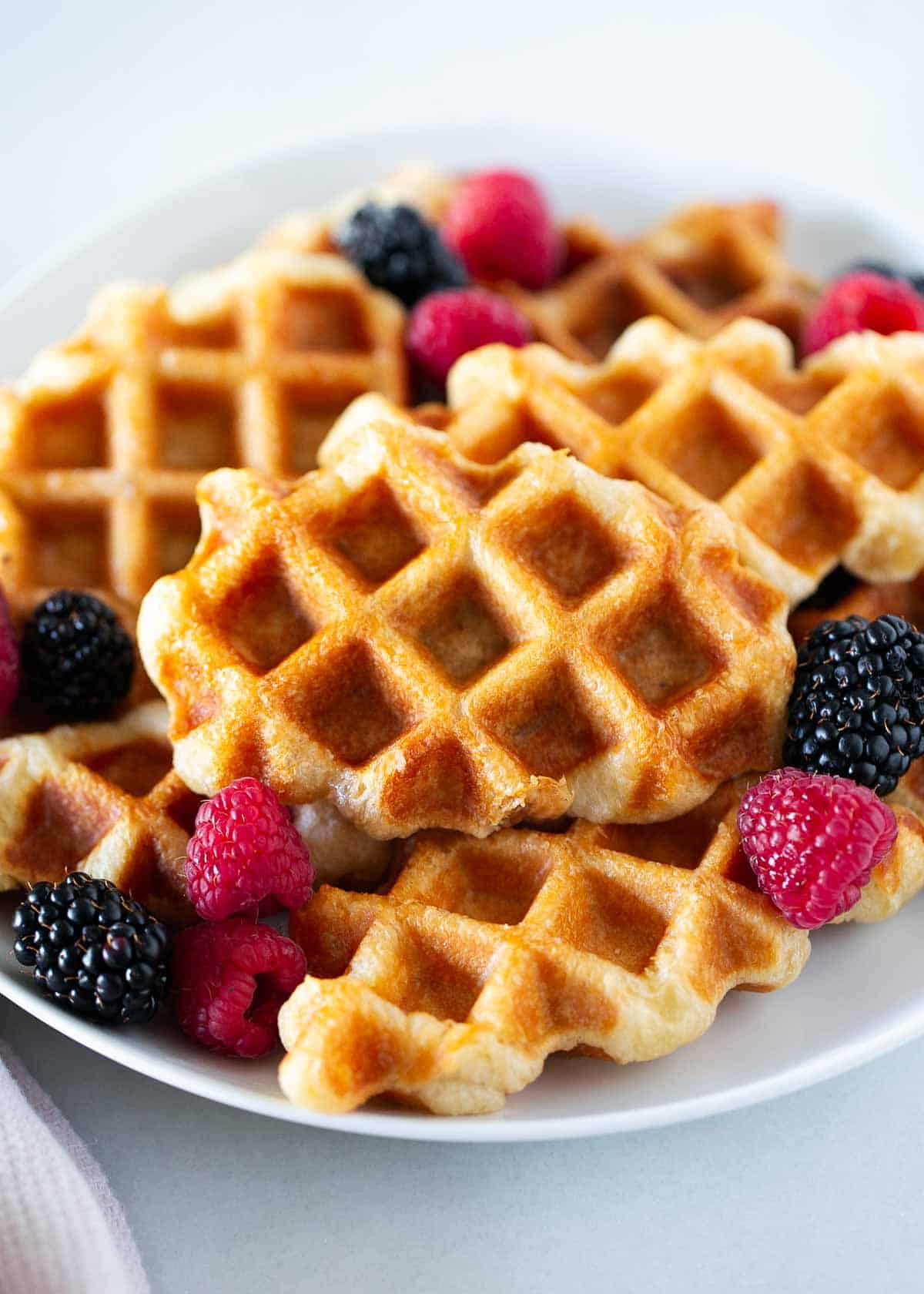 Croffle with berries on a plate.