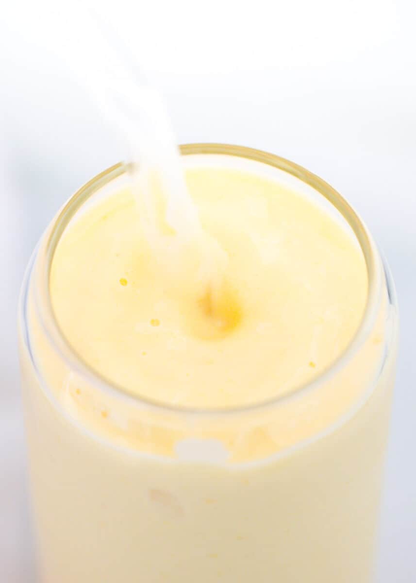 Mango smoothie in a cup.
