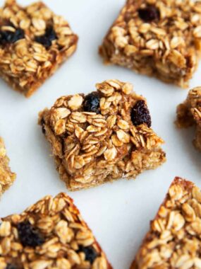 Oatmeal breakfast bars cut into pieces on the counter.