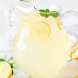 Homemade lemonade in a glass pitcher.