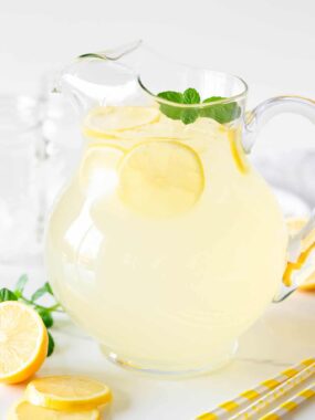Homemade lemonade in a glass pitcher.