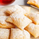 Sopapillas on a plate.