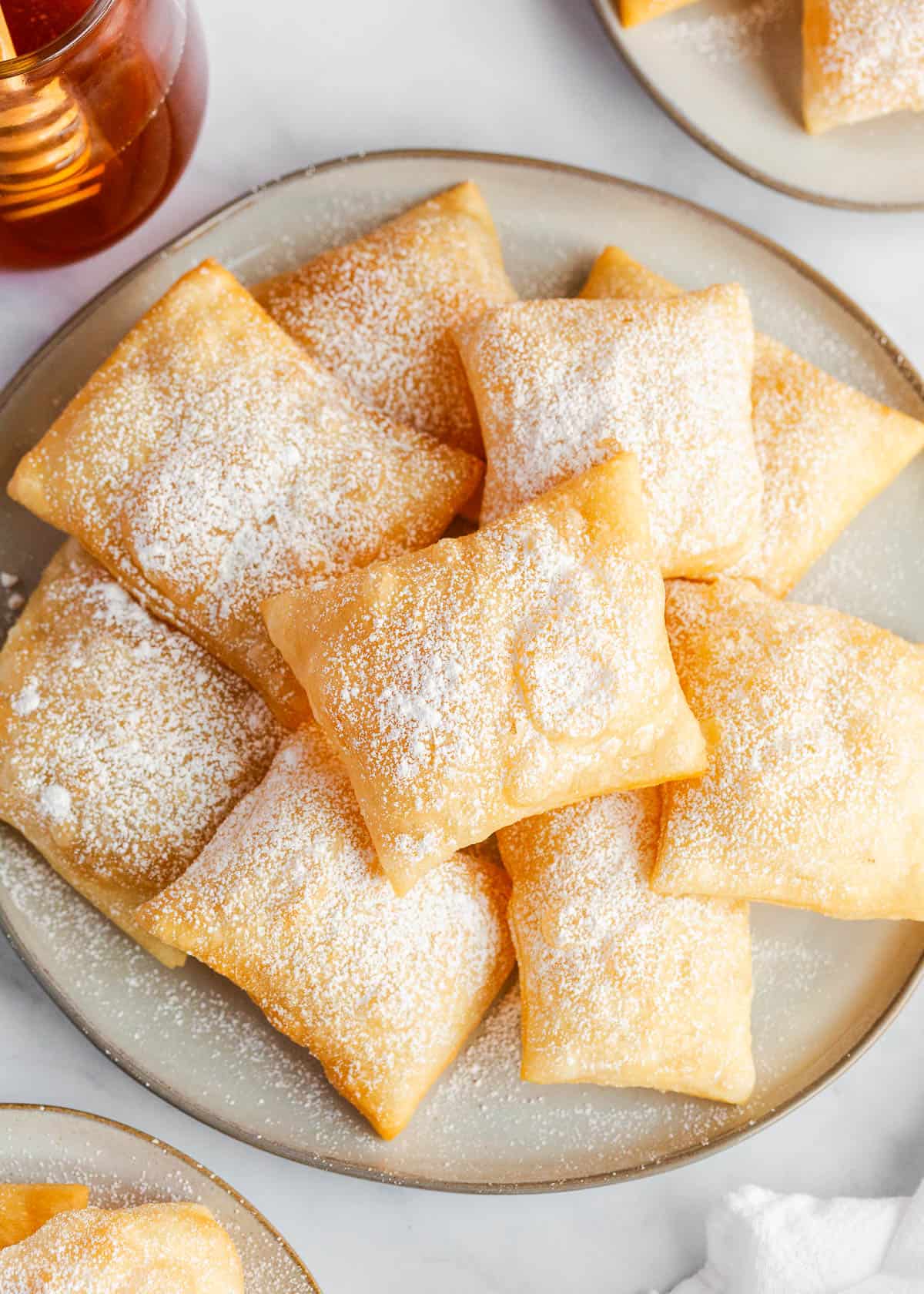 Sopapillas with powdered sugar on top.