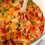 Stuffed pepper casserole in a white pot.