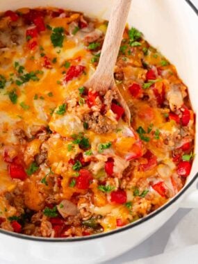 Stuffed pepper casserole in a white pot.