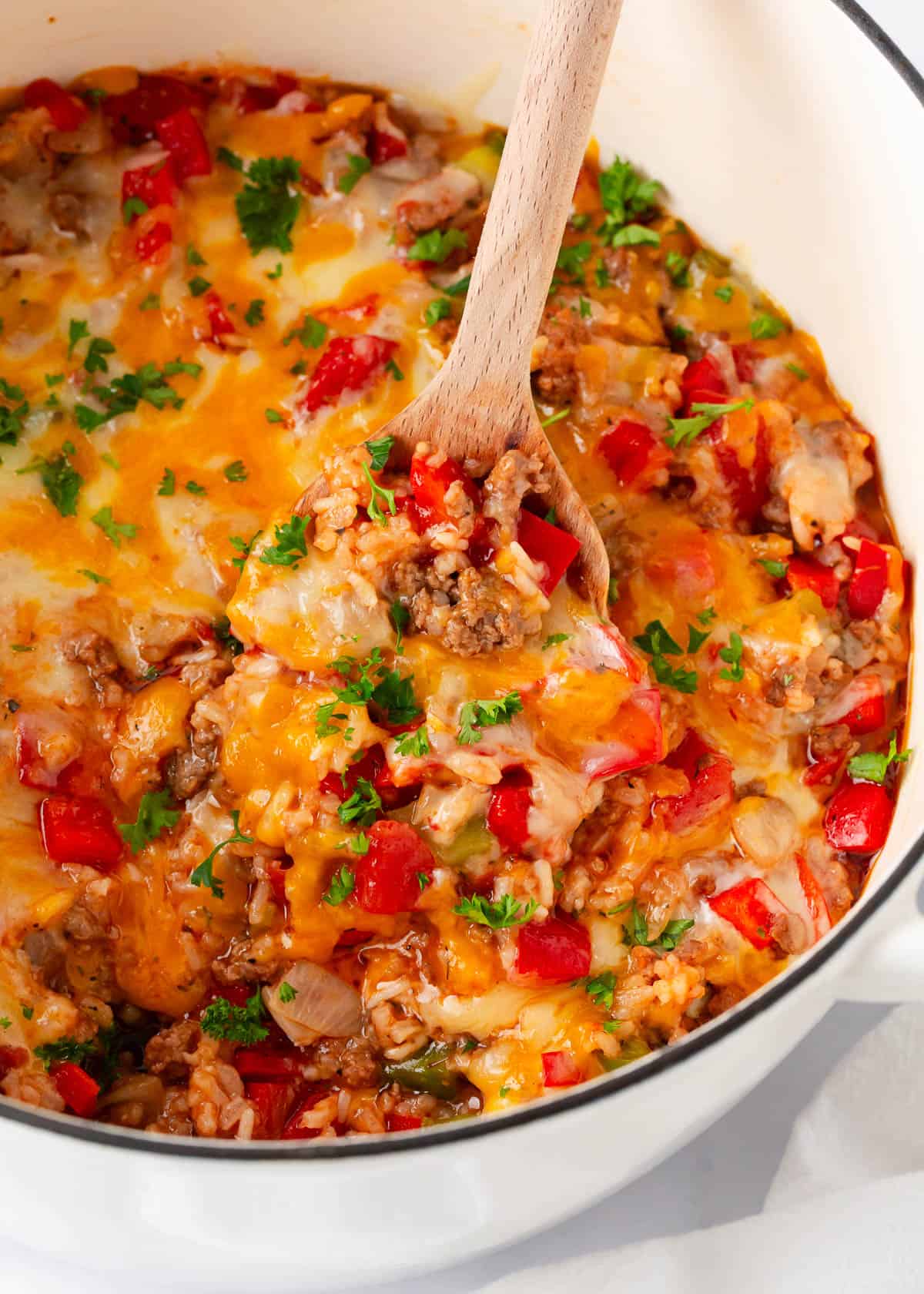 Stuffed pepper casserole in a white pot.