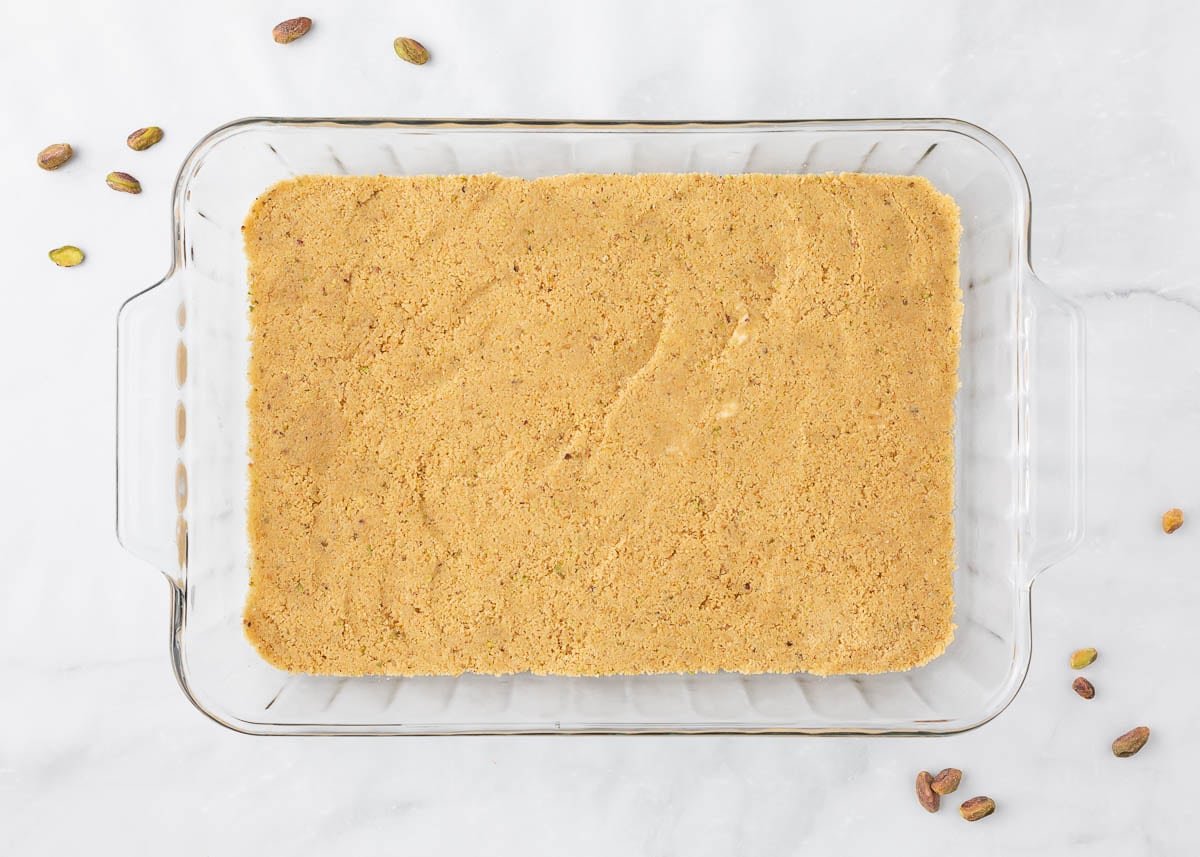 Shortbread cookie base in a pan.