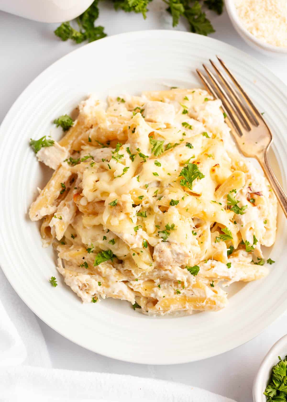 Chicken alfredo bake on a white plate.