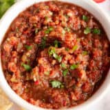 Homemade salsa in a white bowl.