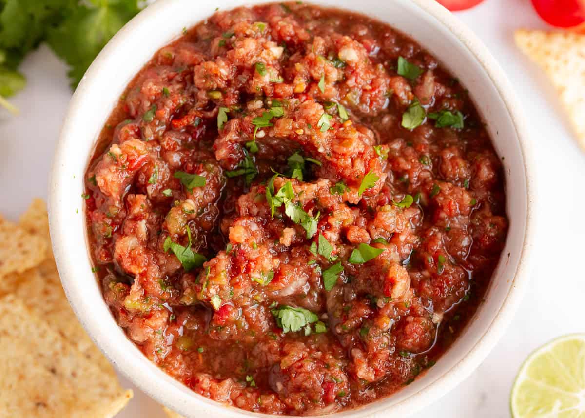 Homemade salsa in a white bowl.