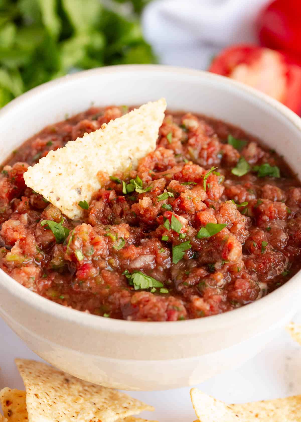 The best homemade salsa always reminds me of my favorite Mexican restaurant. It's fresh, vibrant, and bursting with flavor, perfect for any Mexican-inspired recipe! Homemade salsa in a bowl.