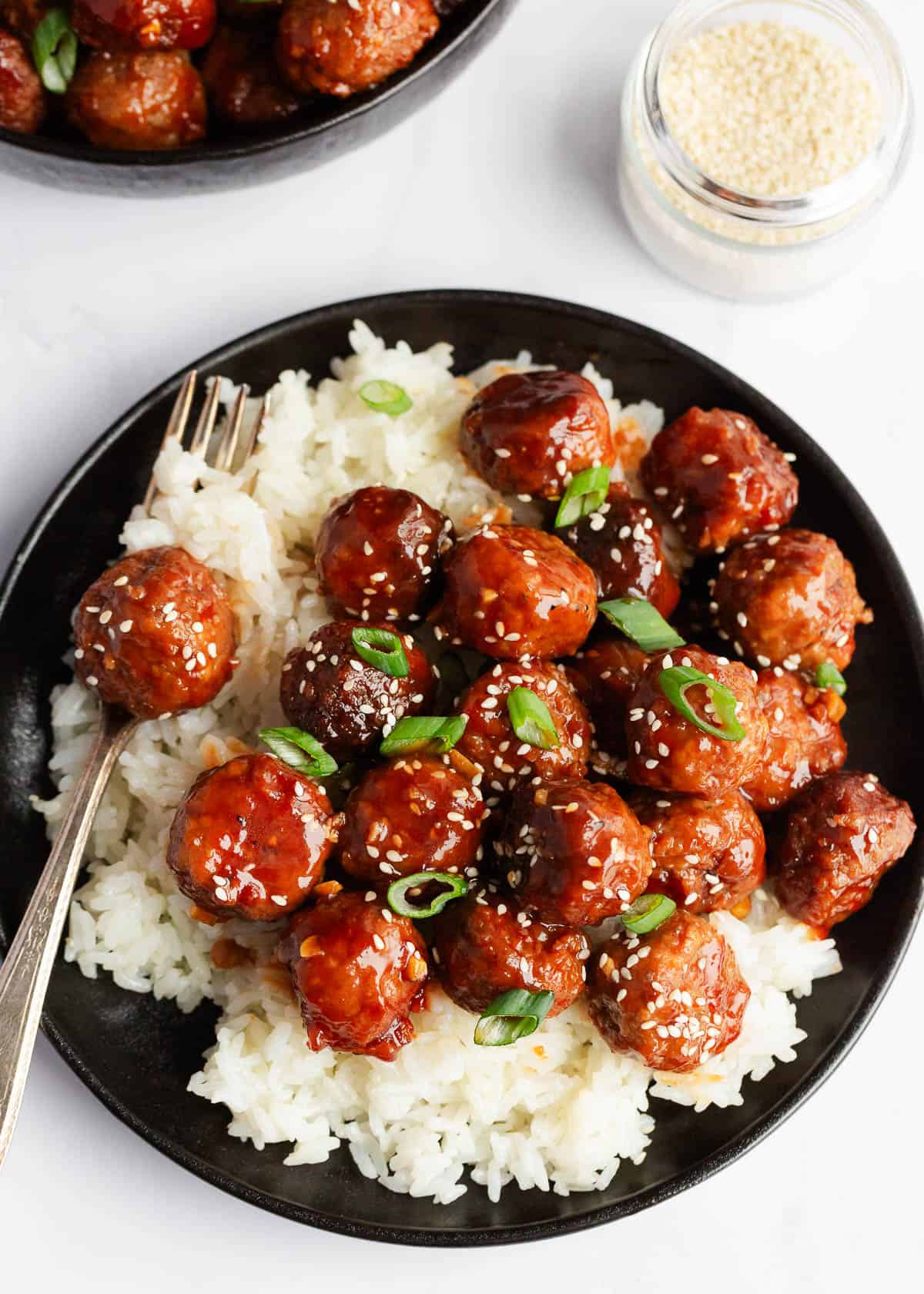 Honey garlic meatballs and rice in a bowl.