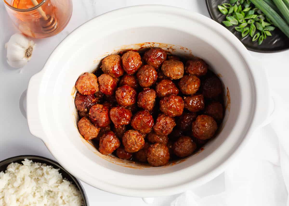 Showing how to make honey garlic meatballs.