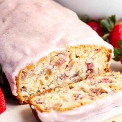 Sliced strawberry bread with strawberry glaze.