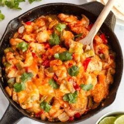 Chicken fajita casserole in a skillet.